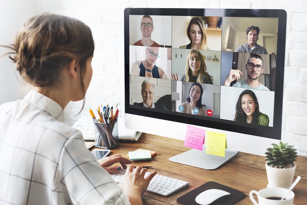 A virtual Zoom call with several participants