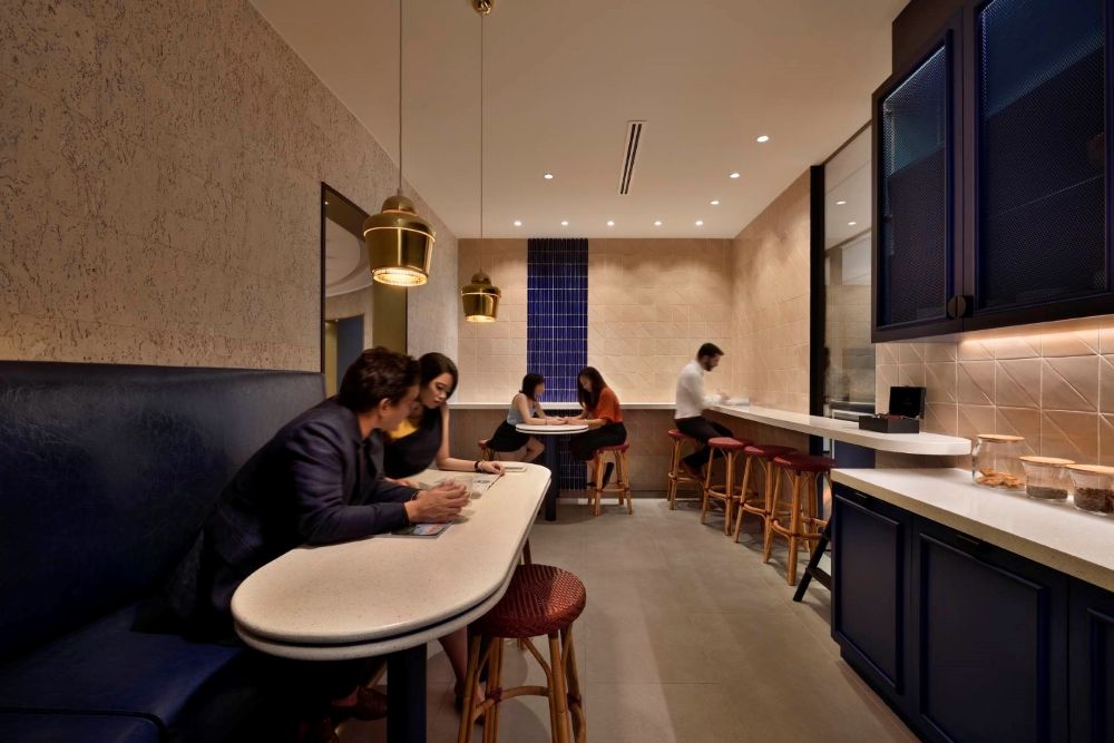 Employees having an agile meeting in the pantry