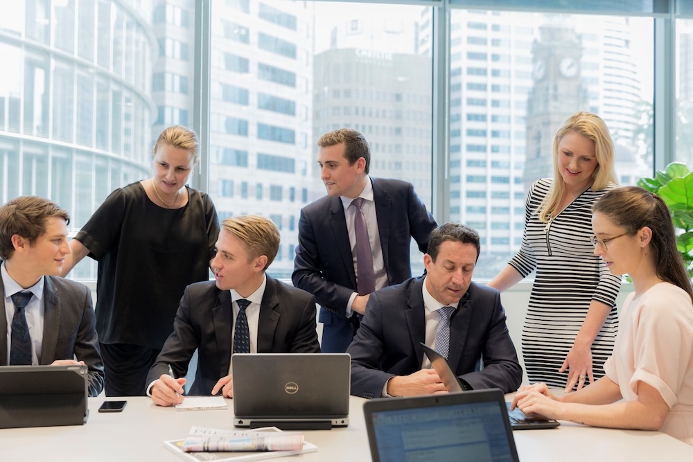 a team conducting a meeting at TWP’s coworking space at 1 Farrer Place, Sydney